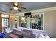 Outdoor patio featuring comfortable seating, stone fireplace, string lights, and a green view at 16 Cambridge Way, Cartersville, GA 30121