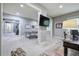 Well-lit recreation room featuring a ping pong table, workspace and doorway to other rooms at 16 Cambridge Way, Cartersville, GA 30121