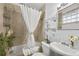 Well-lit bathroom features a shower with a curtain and stylish décor accents at 818 Virgil Ne St, Atlanta, GA 30307