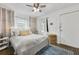 Bright bedroom boasts a ceiling fan, natural lighting, and a stylish area rug at 818 Virgil Ne St, Atlanta, GA 30307
