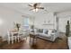 Comfortable living room with hardwood floors, a cozy gray sofa, and a fireplace, creating a relaxing atmosphere at 818 Virgil Ne St, Atlanta, GA 30307