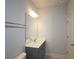 Modern bathroom featuring a vanity with a large mirror, stylish lighting, and a sleek design at 2163 Wiggins Walk, Atlanta, GA 30316