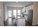 Modern kitchen with stainless steel appliances, granite countertops, and bright white cabinetry at 2163 Wiggins Walk, Atlanta, GA 30316