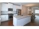 Eat-in kitchen features granite countertops, stainless appliances, and white cabinets at 2163 Wiggins Walk, Atlanta, GA 30316