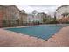 Community pool covered with a winter safety cover surrounded by brick pavers at 2163 Wiggins Walk, Atlanta, GA 30316