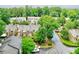 A quiet residential street lined with townhomes surrounded by mature trees at 2197 Spring Walk Ct, Atlanta, GA 30341