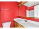 Red bathroom with vanity and mirror at 2197 Spring Walk Ct, Atlanta, GA 30341