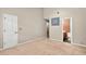 Comfortable bedroom with neutral carpet and access to a bathroom at 2197 Spring Walk Ct, Atlanta, GA 30341
