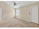 A vacant bedroom features neutral walls and carpet at 2197 Spring Walk Ct, Atlanta, GA 30341
