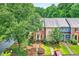 Two-story townhouse with brick, shutters, and landscaped front yard at 2197 Spring Walk Ct, Atlanta, GA 30341