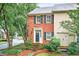 Charming townhome featuring brick facade, complemented by mature landscaping and a welcoming entrance at 2197 Spring Walk Ct, Atlanta, GA 30341
