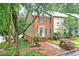 Charming two-story townhouse with brick and landscaped front yard at 2197 Spring Walk Ct, Atlanta, GA 30341