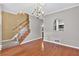 Open concept living room featuring hardwood floors and view of kitchen through an arched pass-through at 2197 Spring Walk Ct, Atlanta, GA 30341