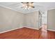 Spacious living room with hardwood floors, neutral paint, and a ceiling fan for a comfortable living space at 2197 Spring Walk Ct, Atlanta, GA 30341