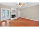 Bright living room featuring hardwood floors, fireplace with white mantel, and access to outdoor space at 2197 Spring Walk Ct, Atlanta, GA 30341