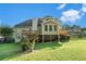 Two-story home with a large deck overlooking a spacious backyard, perfect for outdoor living at 1290 Mount Mckinley Dr, Grayson, GA 30017