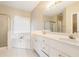 Spacious bathroom featuring double vanity, soaking tub, and glass-enclosed shower at 1290 Mount Mckinley Dr, Grayson, GA 30017