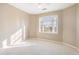 Bright bedroom with carpeting and natural light from the window at 1290 Mount Mckinley Dr, Grayson, GA 30017