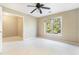 Bedroom with carpet, a ceiling fan, and a window offering natural light at 1290 Mount Mckinley Dr, Grayson, GA 30017