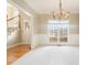 Elegant dining room featuring a chandelier, large windows, and neutral carpeting at 1290 Mount Mckinley Dr, Grayson, GA 30017