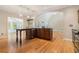 Well-designed kitchen island featuring hardwood floors, stainless steel appliances, and open floor plan at 1290 Mount Mckinley Dr, Grayson, GA 30017