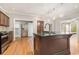 Gourmet kitchen with a large island, stainless steel appliances, and hardwood floors at 1290 Mount Mckinley Dr, Grayson, GA 30017