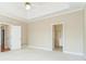 Bright and airy main bedroom featuring tray ceilings, with ensuite bathroom at 1290 Mount Mckinley Dr, Grayson, GA 30017