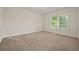 Bright bedroom featuring a large window bringing in lots of natural light at 1902 Connemara Dr, Atlanta, GA 30341