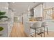 Modern kitchen featuring white cabinets, stainless steel appliances, and a marble countertop island at 1902 Connemara Dr, Atlanta, GA 30341