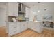 Modern kitchen featuring white cabinets, stainless steel appliances, and a marble countertop island at 1902 Connemara Dr, Atlanta, GA 30341