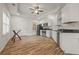 Bright kitchen features white cabinets, black appliances, and a dining area, perfect for modern living at 1902 Connemara Dr, Atlanta, GA 30341