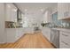Bright kitchen features white cabinetry, stainless appliances, and hardwood flooring at 1902 Connemara Dr, Atlanta, GA 30341