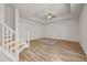 Living room featuring a modern ceiling fan, recessed lighting, and wooden floors at 1902 Connemara Dr, Atlanta, GA 30341