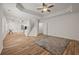 Living room featuring a ceiling fan, recessed lighting, and wooden floors at 1902 Connemara Dr, Atlanta, GA 30341