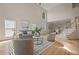 Bright living room with hardwood floors, high ceilings, a fireplace and neutral-toned furniture at 1902 Connemara Dr, Atlanta, GA 30341