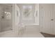 Bathroom features a soaking tub and separate walk-in shower with a glass door at 1902 Connemara Dr, Atlanta, GA 30341