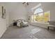 Spacious main bedroom features a large window and neutral decor at 1902 Connemara Dr, Atlanta, GA 30341
