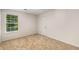 Clean bedroom features plush carpet and a window at 7167 Stonebrook Ln, Lithonia, GA 30058