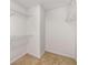 Empty walk-in closet with carpet flooring and multiple levels of wire shelving at 7167 Stonebrook Ln, Lithonia, GA 30058