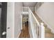 Bright foyer with hardwood floors and staircase to the upper level at 7167 Stonebrook Ln, Lithonia, GA 30058