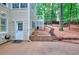 Exterior view of backyard showcasing landscaping with wood steps and natural wood features at 1850 Noblin Ridge Way, Duluth, GA 30097