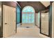 Bathroom featuring a large soaking tub, a walk-in shower, and an arched window for natural light at 1850 Noblin Ridge Way, Duluth, GA 30097
