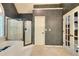 Bathroom with a combination tub and shower, and glass french doors leading to another room at 1850 Noblin Ridge Way, Duluth, GA 30097