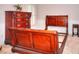Bedroom showcases a partially assembled sleigh bed frame and a matching wooden chest of drawers at 1850 Noblin Ridge Way, Duluth, GA 30097