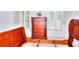 Bedroom showcasing a partially assembled sleigh bed frame and a matching wooden chest of drawers at 1850 Noblin Ridge Way, Duluth, GA 30097