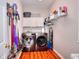 Well-equipped laundry room with modern washer and dryer and built-in storage at 1850 Noblin Ridge Way, Duluth, GA 30097