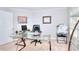 Bright office with a glass desk, a black leather chair, and a modern printer setup at 1850 Noblin Ridge Way, Duluth, GA 30097