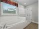 Bright bathroom with a soaking tub and walk-in shower at 614 Denali Dr, Mableton, GA 30126