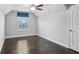 Bedroom with hardwood floors, ceiling fan, and a bright window at 614 Denali Dr, Mableton, GA 30126