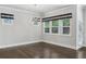 This dining room features hardwood floors, modern light fixture, and stylish window coverings at 614 Denali Dr, Mableton, GA 30126